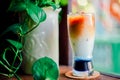 Iced butterfly pea latte on wooden table in coffee cafe , background coffee Royalty Free Stock Photo