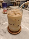 Iced Caffee Latte on Marble Table with Elegant Cafe Ambiance