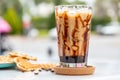 Iced caramel latte coffee in a tall glass with caramel syrup Royalty Free Stock Photo