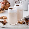 Iced chai latte with warm winter spices topped with milk foam Royalty Free Stock Photo