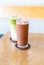 iced chocolate and iced matche green tea on wood table Royalty Free Stock Photo