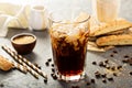 Iced coffee being poured in a glass