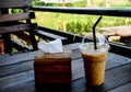 Iced coffee on brown wooden table Royalty Free Stock Photo