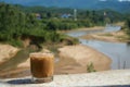 Iced coffee or caffe latte in front of a nice blurred landscape in Vietnam, Phong NhaKe Bang Nationalpark. Royalty Free Stock Photo