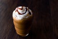 Iced Coffee Caramel Frappe / Frappuccino with Whipped Cream and Caramel Syrup. Royalty Free Stock Photo