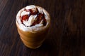 Iced Coffee Caramel Frappe / Frappuccino with Whipped Cream and Caramel Syrup. Royalty Free Stock Photo