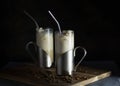 Iced coffee chillers in tall glass mugs with coffee beans