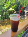 Iced Coffee in a clear plastic glass Royalty Free Stock Photo