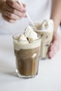 Iced coffee cocktail or frappe with ice cubes and cream Royalty Free Stock Photo