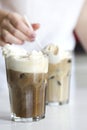 Iced coffee cocktail or frappe with ice cubes and cream Royalty Free Stock Photo