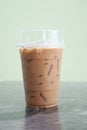 Iced coffee glass on the marble table with green background Royalty Free Stock Photo