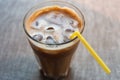 Iced coffee with a straw, closeup