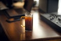 Iced americano coffee in glass on work table at home