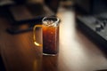 Iced americano coffee in glass on work table at home