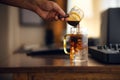 Iced coffee in glass on work table at home