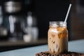 iced coffee latte in a jar, with straw and label for easy take-away