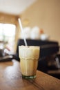 Iced coffee latte in a tall glass with caramel and chocolate syrup and whipped cream Royalty Free Stock Photo