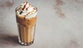 Iced coffee latte with whipped cream, topped with caramel sauce, in a tall glass Royalty Free Stock Photo