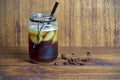 iced coffee with a lot of ice in a canning jar, idea of recycling. Summer drink