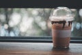Iced coffee and milk cream with chocolate sauce in take away glass Royalty Free Stock Photo