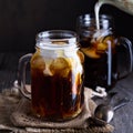 Iced coffee with milk in mason jars