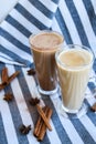 Iced coffee with milk in tall glasses, Cups of tasty frappe coffee, Latte machiato, two cups of cappuccino with cinnamon