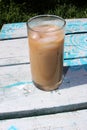 Iced Coffee on picnic table outsdie Royalty Free Stock Photo