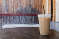 An iced coffee in a sitting on a small table outdoors at a locally owned coffee shop in Hawaii Royalty Free Stock Photo