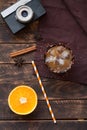 Iced coffee in a tall glass on an old wooden background