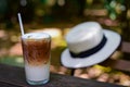 Iced coffee in a tall glass and whip cream on the top Royalty Free Stock Photo