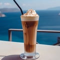 Iced coffee with whipped cream on the terrace in Santorini, Greece Royalty Free Stock Photo