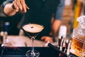 Iced coffee, whiskey based irish cocktail. bartender hand preparing beverage