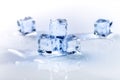 Iced cubes melting on a blue table with reflection. Water. Melting of ice. Royalty Free Stock Photo