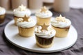 iced cupcakes, each with a unique snowflake design