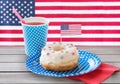 iced donut with american flag decoration and juice