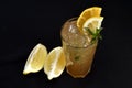 Iced drink with citrus fruits lemon orange alcoholic cocktail martini vodka margerita run tropical fruit juice Royalty Free Stock Photo