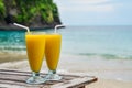 Mango smoothies at beach Royalty Free Stock Photo