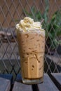 Iced Espresso with whipped cream set on the table ready to serve. Royalty Free Stock Photo