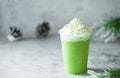 Iced green matcha latte tea and milk in glass on stone table background. Traditional japanese drink  and beverage concept Royalty Free Stock Photo