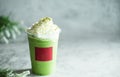 Iced green matcha latte tea and milk in glass on stone table background. Traditional japanese drink and beverage concept Royalty Free Stock Photo