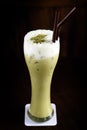 Iced Green tea latte on black background Royalty Free Stock Photo