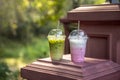 Iced green tea matcha latte and Pink strawberry milk shake in plastic glass Royalty Free Stock Photo