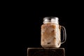 Iced latte coffee in cup glass on black background. Close-up, copy space Royalty Free Stock Photo