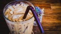 Iced Latte Coffee In A Glass With Cream On Bottom . Cold Summer Drink Background