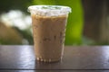 Iced latte coffee in a tall glass. cold summer drink background