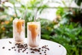 Iced latte coffee on white table