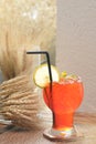 Iced lemon tea with lime and mint decoration on wooden and cereal background - Soft focus Royalty Free Stock Photo