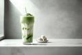 Iced matcha green tea latte in glass on white marble table Royalty Free Stock Photo