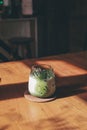 Iced matcha green tea latte with milk on wooden table, Perfect for breakfast time..Japanese style.