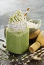 Iced matcha latte with coconut cream Royalty Free Stock Photo